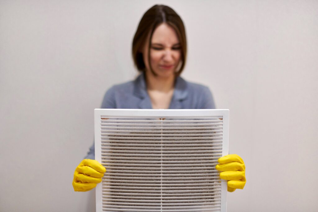 woman with a dirty air filter