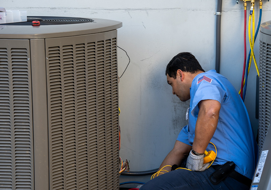 AC Technician Fixing an AC In San Diego