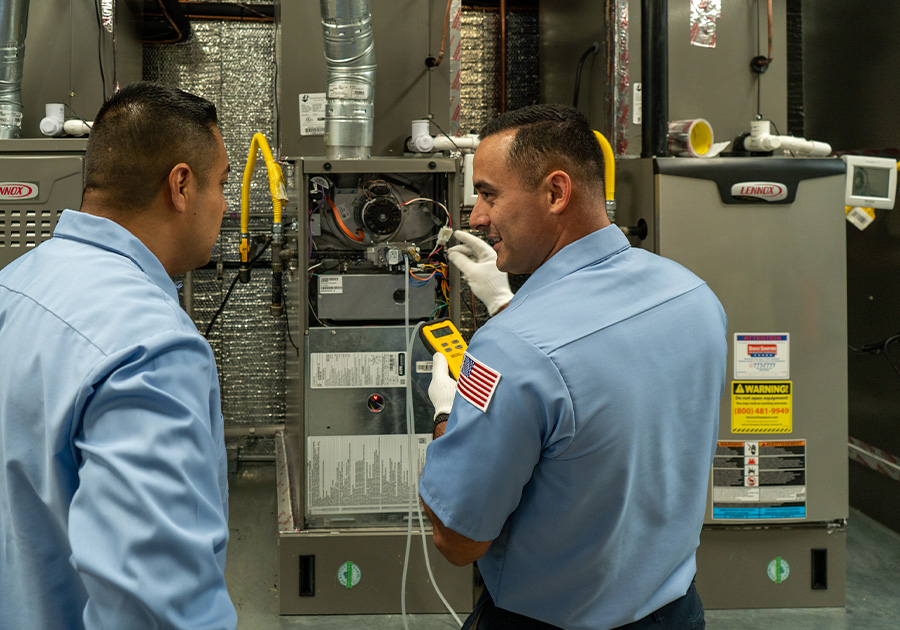 ASI technician performing furnace repair