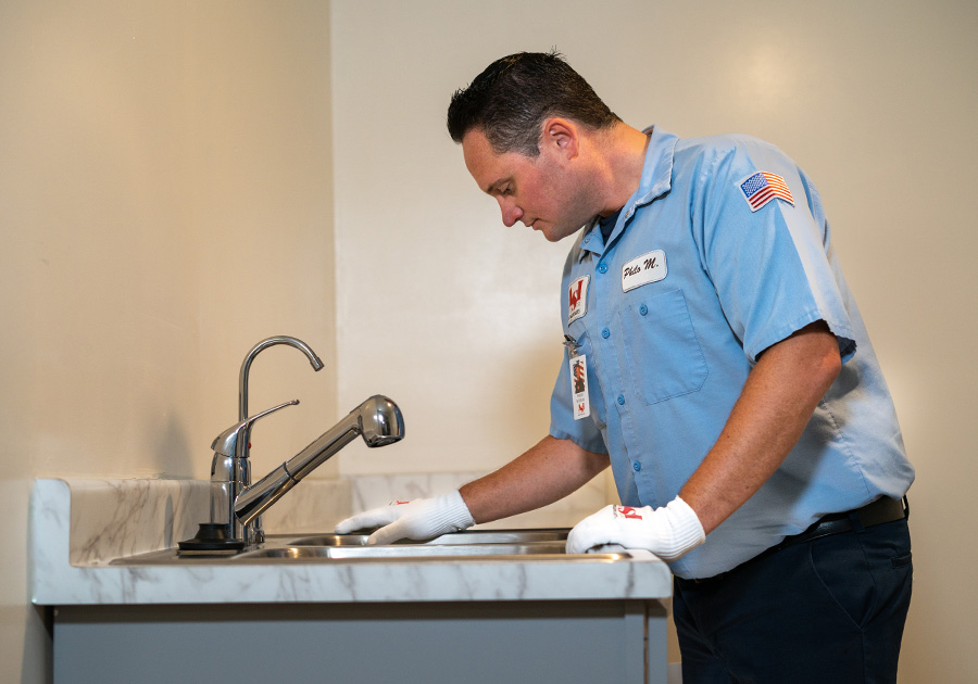 Plumber look at the new water filtration system